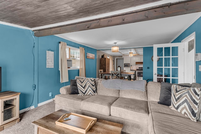 carpeted living room with ceiling fan, crown molding, and wood ceiling