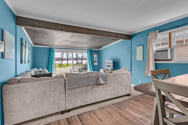 living room with hardwood / wood-style floors, cooling unit, and crown molding