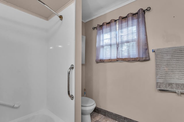 bathroom featuring toilet, crown molding, and bathtub / shower combination