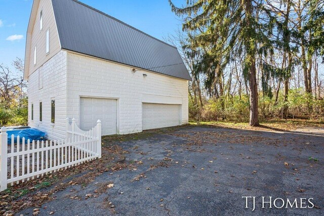 view of side of home with a garage