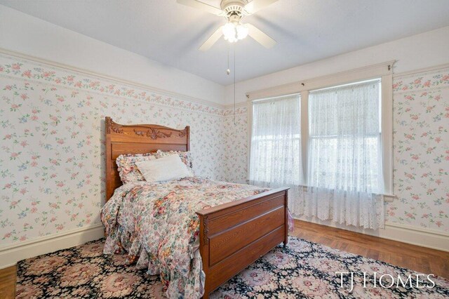 bedroom featuring ceiling fan and light hardwood / wood-style flooring