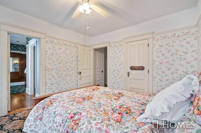 bedroom with hardwood / wood-style floors and ceiling fan