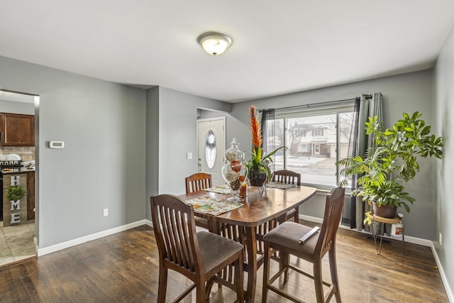 dining room with dark wood-type flooring