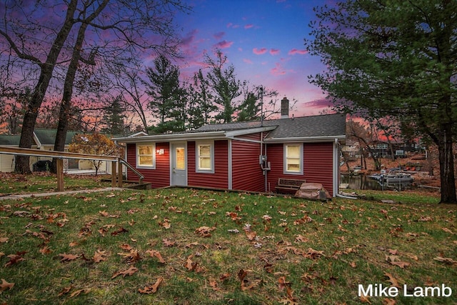 view of front of home with a lawn