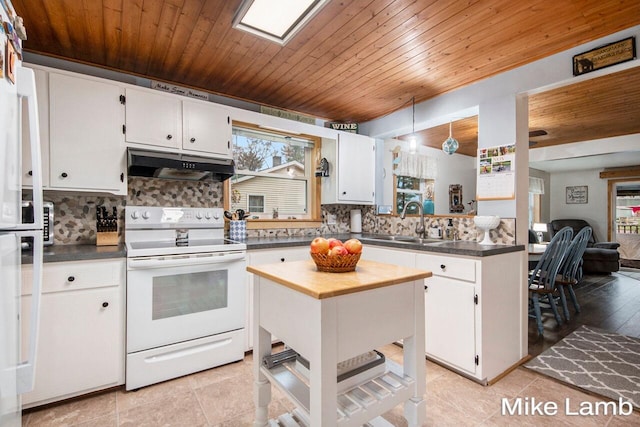 kitchen featuring white cabinets, light tile patterned flooring, and white electric stove