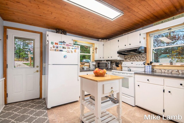 kitchen with white cabinetry, a healthy amount of sunlight, and white appliances