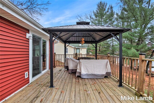 wooden terrace with a gazebo