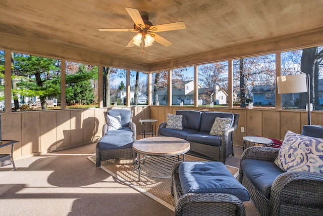 sunroom / solarium with a wealth of natural light, ceiling fan, and wood ceiling