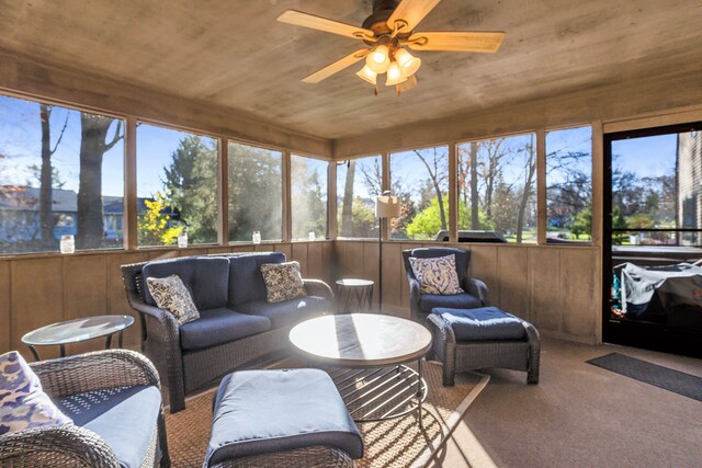 sunroom / solarium featuring wooden ceiling and ceiling fan