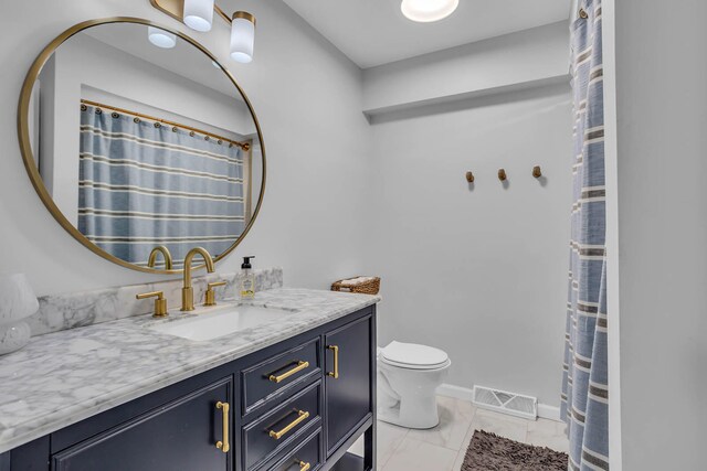 bathroom with toilet and vanity