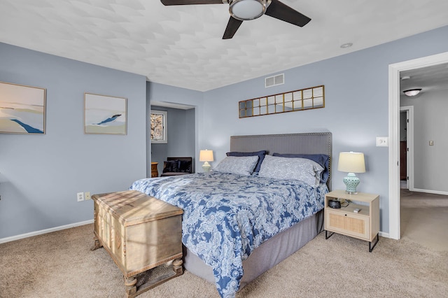 bedroom with light colored carpet and ceiling fan