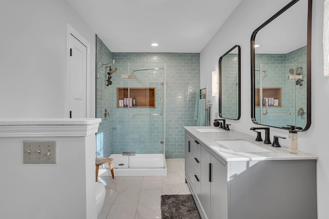 bathroom featuring vanity and an enclosed shower