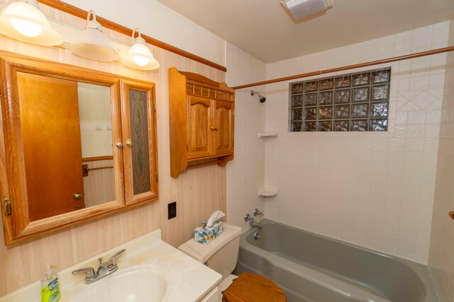 full bathroom with vanity, toilet, and tiled shower / bath