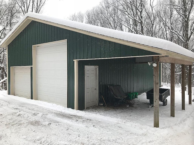 view of snow covered garage