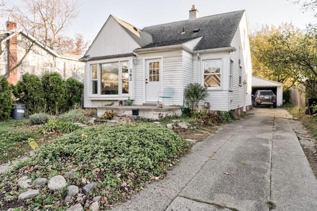 view of front of house featuring a garage and a carport