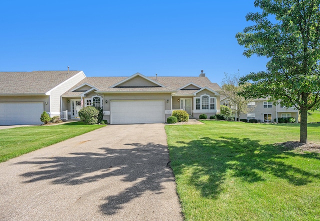 view of front of house featuring a garage and a front yard