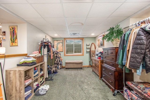 bedroom featuring carpet floors and a paneled ceiling