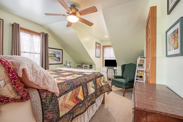 bedroom featuring lofted ceiling, ceiling fan, and carpet floors