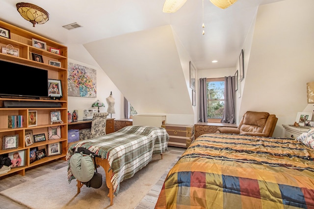 bedroom with light hardwood / wood-style flooring and vaulted ceiling