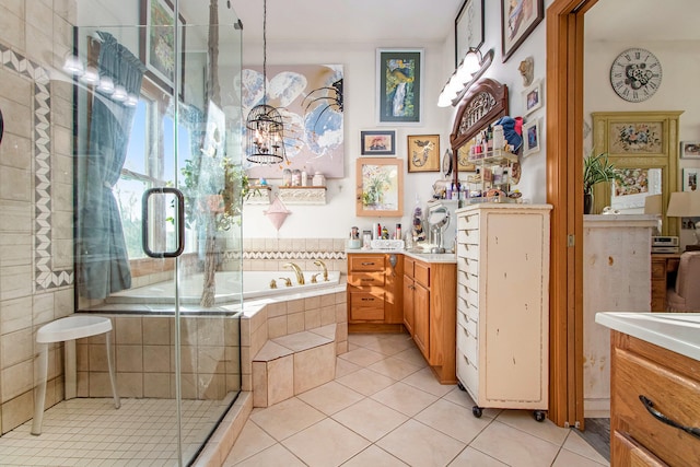 bathroom featuring vanity, tile patterned floors, and separate shower and tub