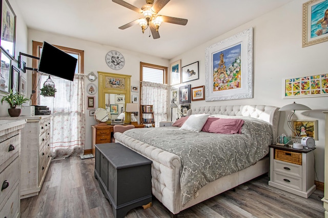 bedroom featuring dark wood-type flooring and ceiling fan