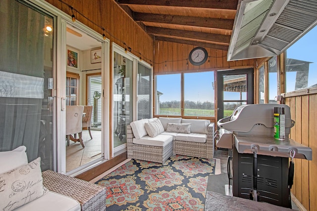 sunroom with lofted ceiling with beams and wooden ceiling