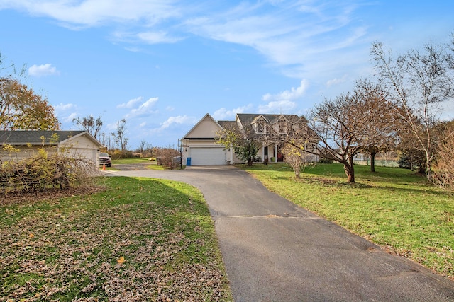 view of front facade with a garage and a front yard