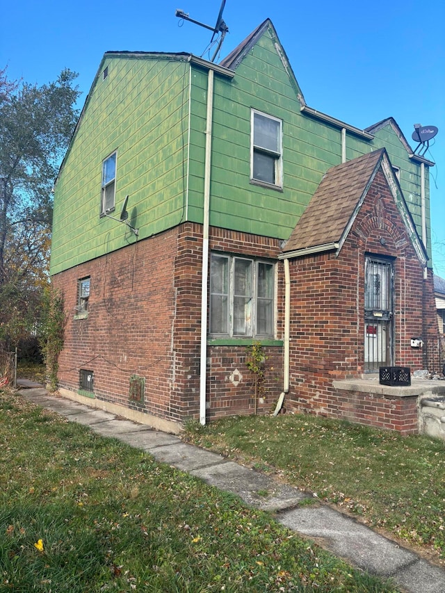 view of home's exterior with a yard