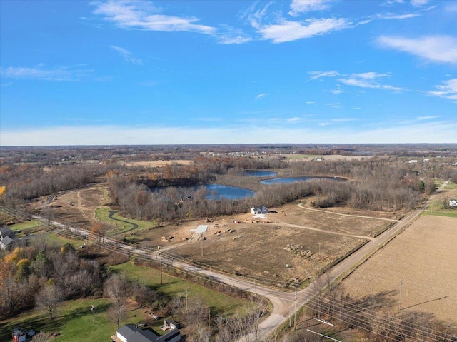 aerial view with a water view and a rural view