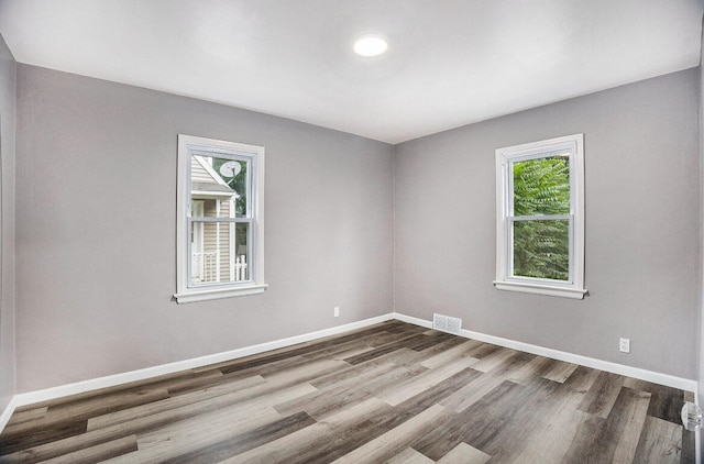 spare room featuring hardwood / wood-style flooring