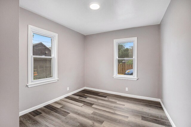 spare room featuring hardwood / wood-style floors