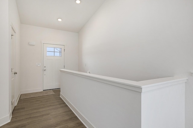 interior space featuring dark wood-style floors, baseboards, and recessed lighting