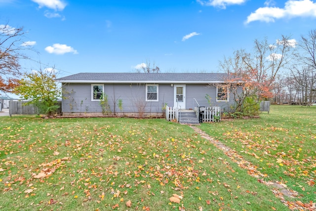 back of house with a lawn