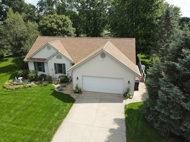 single story home with a garage and a front yard