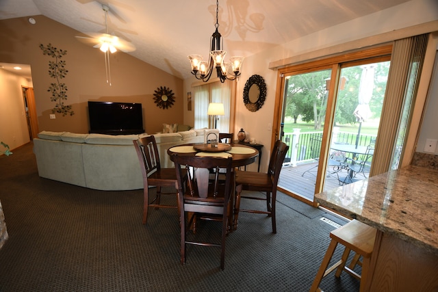 dining area featuring ceiling fan with notable chandelier, vaulted ceiling, and dark carpet