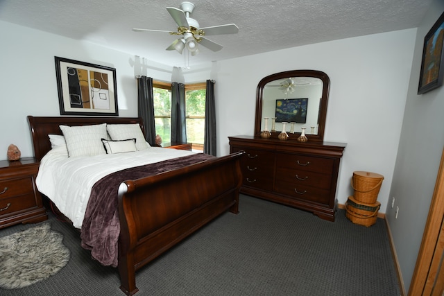 carpeted bedroom with a textured ceiling and ceiling fan