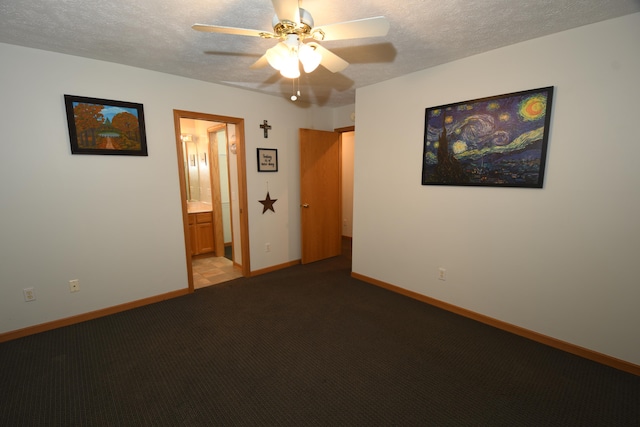 spare room with light colored carpet, a textured ceiling, and ceiling fan