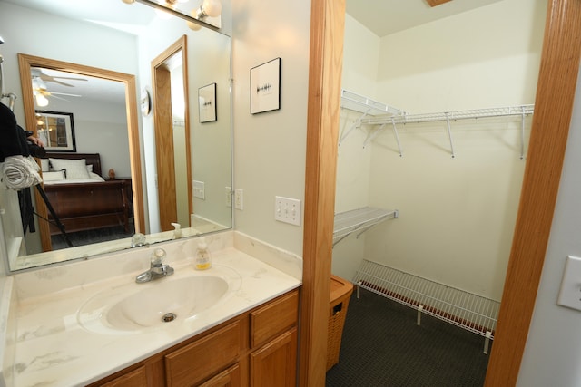 bathroom featuring vanity and ceiling fan