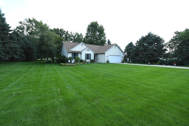 view of front of home with a garage and a front yard