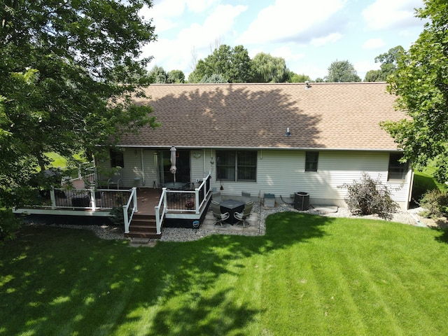 back of property with a patio, central AC, a lawn, and a deck