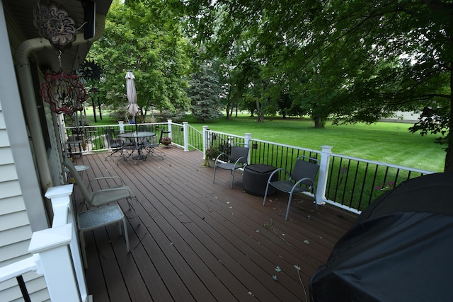 deck featuring a lawn