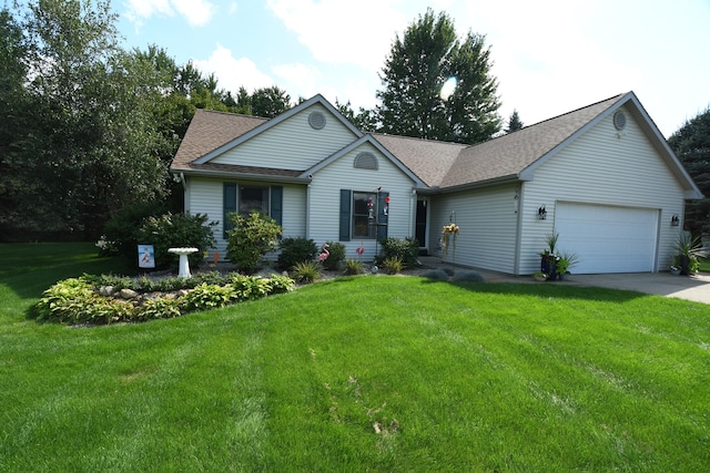 ranch-style house featuring a garage and a front yard