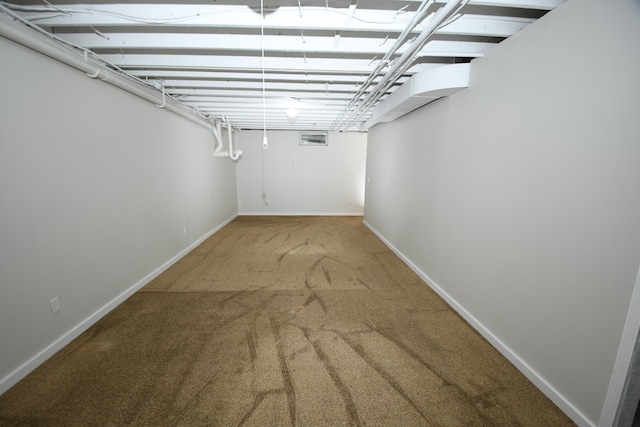 basement featuring carpet flooring