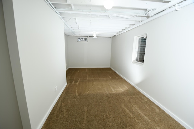 interior space with dark colored carpet