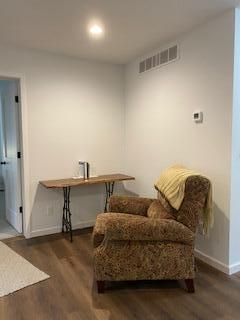 living area with dark hardwood / wood-style floors