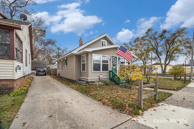 view of front of home with an outdoor structure and a garage