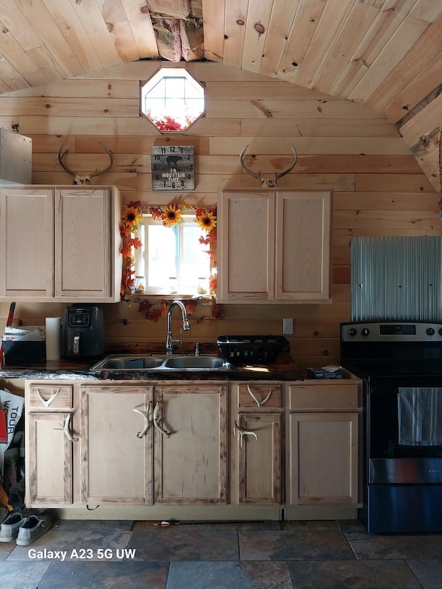 kitchen featuring vaulted ceiling, stainless steel electric stove, and wooden walls