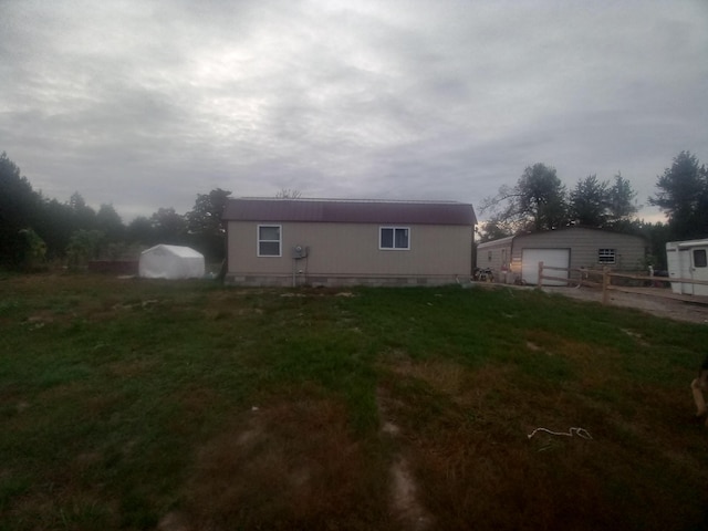 exterior space with an outbuilding and a garage