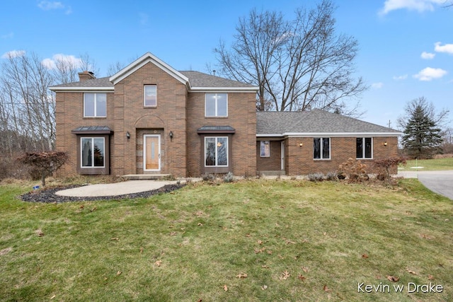 front of property with a patio and a front yard