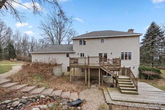 rear view of house featuring a deck